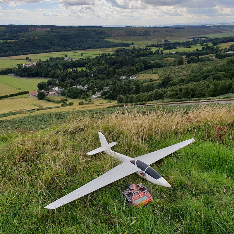Photo of glider model in flight